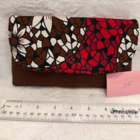 35: Clutch brown and red item