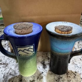 2 of Cabbages & Kings Pottery travel mugs ($100 value) item