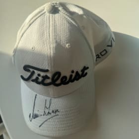A signed Simon Khan hat and shirt (Pro Golfer) item