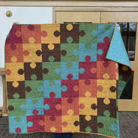 Item 108 Puzzle Quilt item