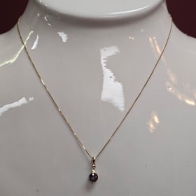 Ladies 14k yellow gold Mystic Fire Topaz and Diamond pendant item