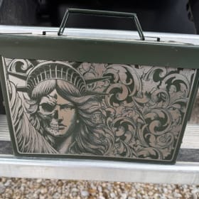 Custom engraved ammo boxes – one metal and one plastic item