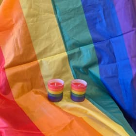 Pride flag and 2 candles item