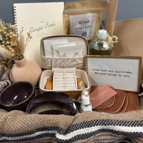 “Cozy Luxe & Golden Touches” Basket Estimated Value: $376 item