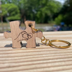 Building Better Beginnings Puzzle Piece Keychain (Gold) item
