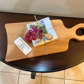 Artisan charcuterie board with cheese knives item