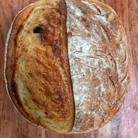 Photo of Three fresh hand made loaves of Sourdough by Jessica Moss
