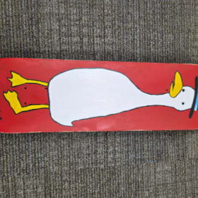Photo of duck in a hat by Cory Bushore