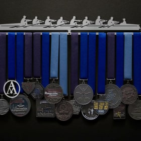 Medal hanger (male figures) item