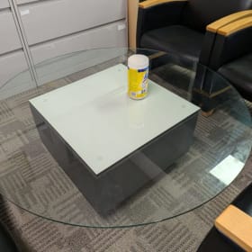 Glass Coffee table 4.5'Wx16.5"H with leather base item