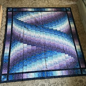 Photo of Blue and Purple Bargello Quilt, Handmade by a Volunteer