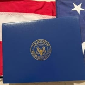Photo of US Flag Flown Over the United States Capitol Building