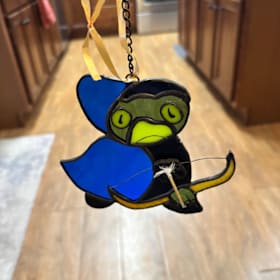 Photo of Stained glass ornament of spider monkey from Bloons TD