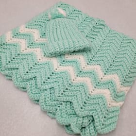 Photo of Hand crocheted baby blanket & hat