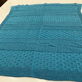 Photo of #2. Hand-knitted Baby Blanket by Robin Sheerer