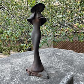 Photo of #10. Raku Pottery Woman with Hat & Cape Statue