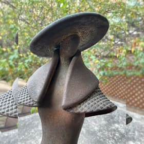Photo of #10. Raku Pottery Woman with Hat & Cape Statue