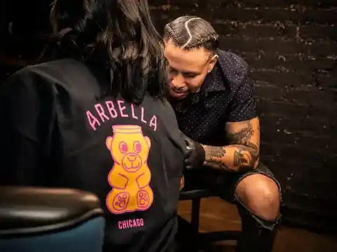 Tony Wulfman tattooing a client in his Chicago studio