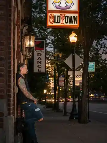 Tony Wulfman outside his Chicago tattoo studio at dusk
