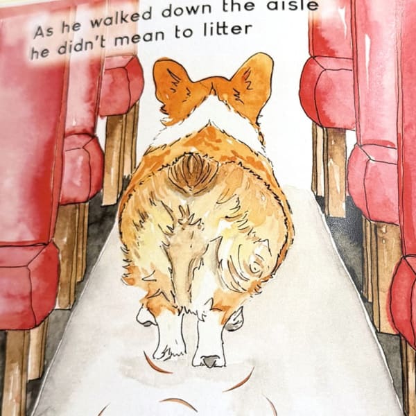 Rally walks down the train aisle leaving a trail of corgi fur