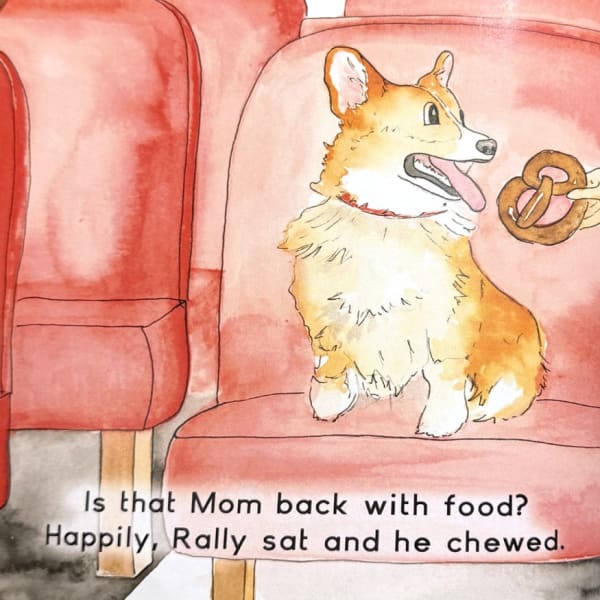 Rally waits happily as Mom offers a pretzel