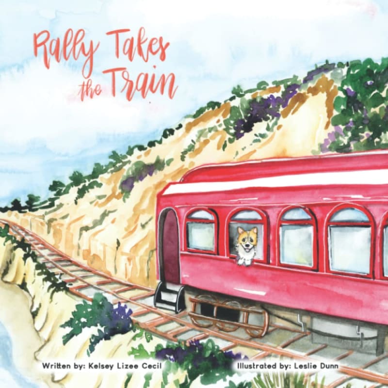 Rally Takes the Train book cover: a watercolor corgi peeking from a red train on the coastal cliffs
