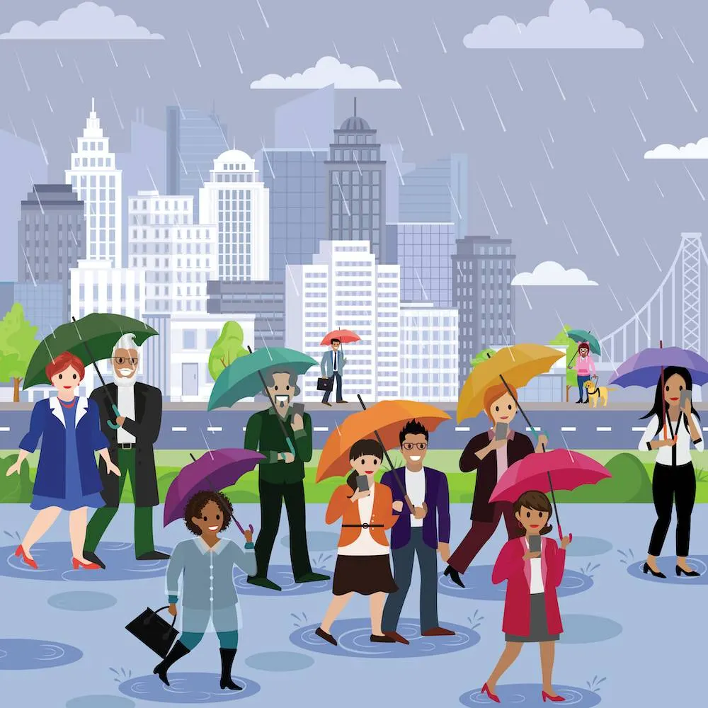 サンフランシスコの摩天楼を背景に、雨の中、傘をさして通勤する人々