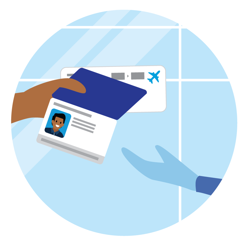 A security guard checks the ID and boarding pass of an airline passenger