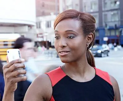 Woman holding a mobile device