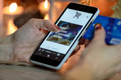 Shopping on a mobile device. Sites that accept payments from a mobile wallet see a 14 percent increase in mobile orders.