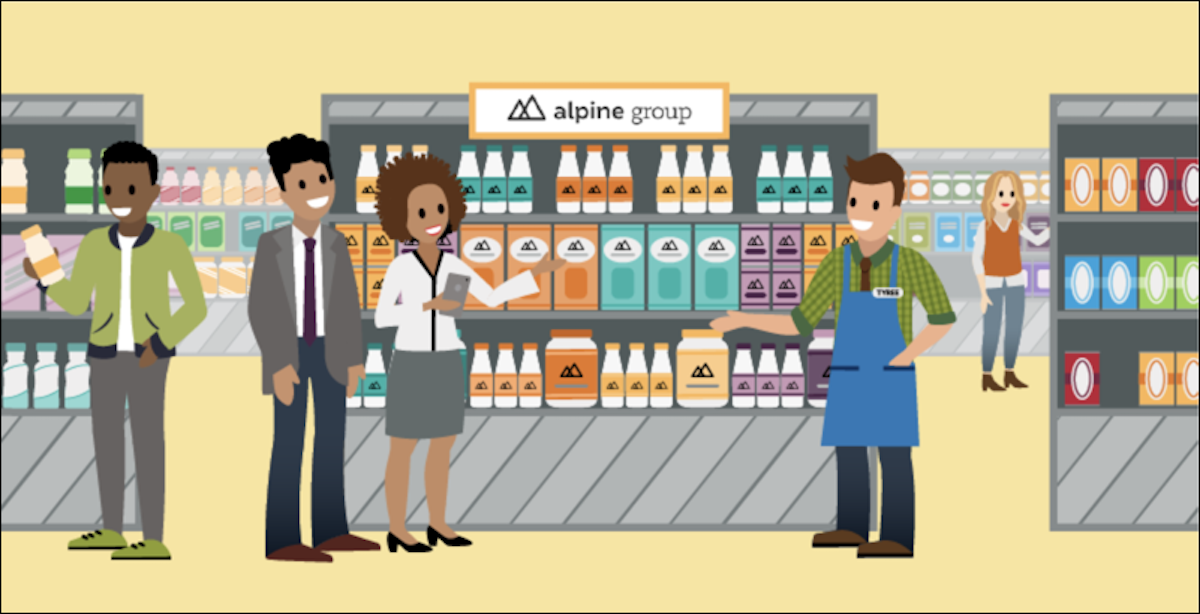 A picture showing buyers and store managers in front of an aisle in an NTO store. The aisle showcases Alpine products.