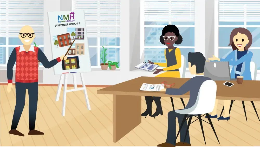 Gorav und das Entwicklungsteam von No More Homelessness besprechen ein bevorstehendes Projekt.