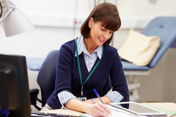 Customer service agent works at her desk.