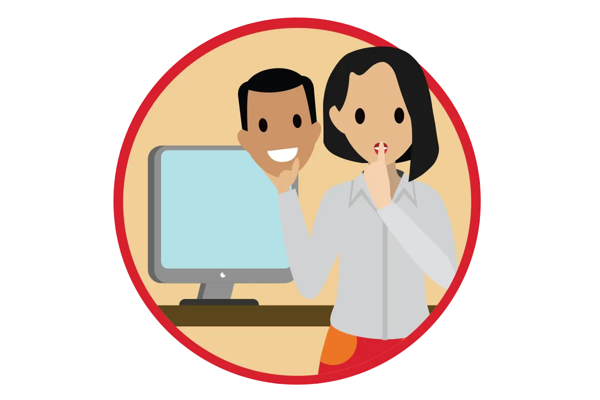 Eine Person steht vor einem Computer und hält eine Maske in der Hand.
