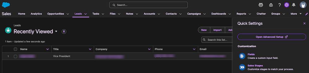 An example Salesforce org Leads page in Salesforce Cosmos theme dark mode, with a black background, white and purple text, and bright-colored Salesforce Lightning Design System 2 buttons