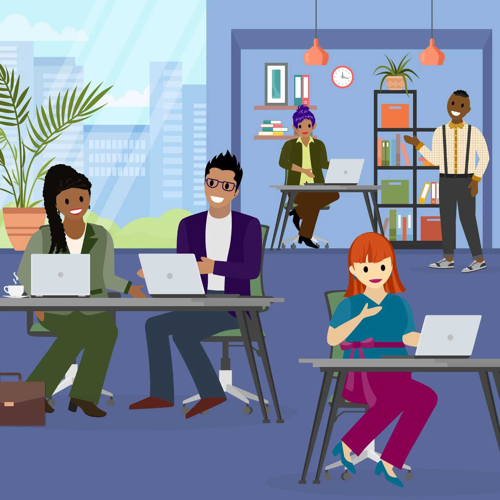 Office workers at desks with laptops.