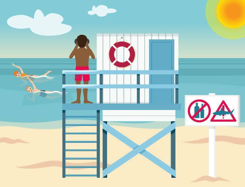 A lifeguard is standing in his tower, watching over a beach. A sign with a red triangle and an exclamation mark indicates a shark hazard.