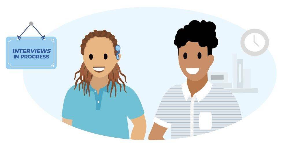 A woman with a cochlear implant and a non-binary person sit in a waiting room prior to their interviews.