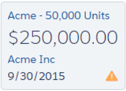 アラートアイコンが表示されている Acme - 50,0000 Units 商談カード。