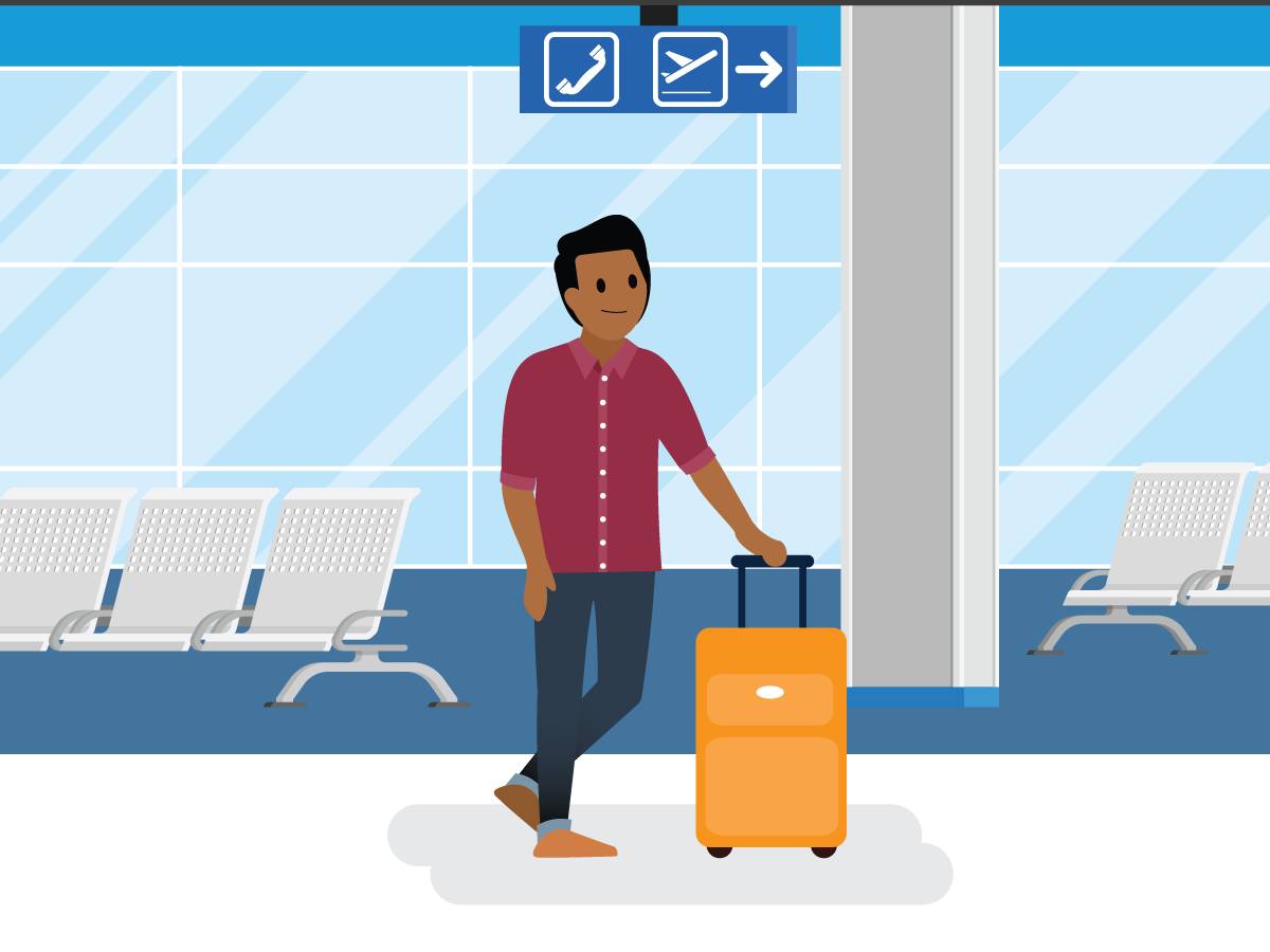 Un hombre caminando por un aeropuerto.