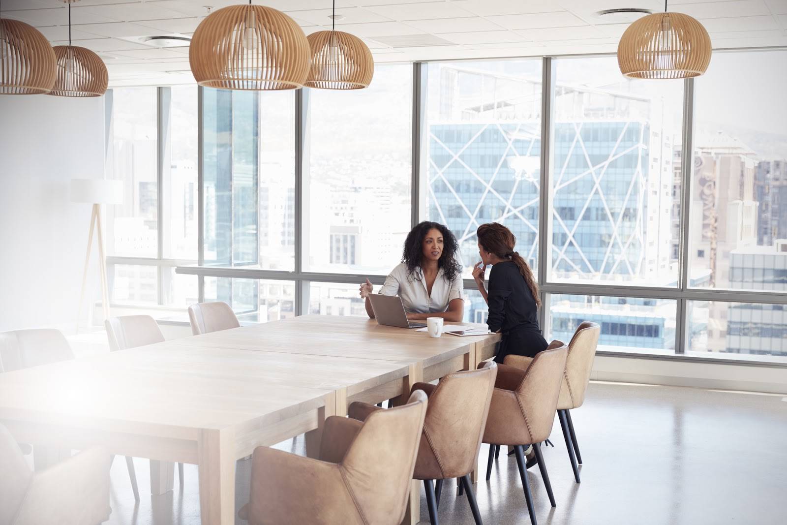 A photo of two people holding a business meeting.