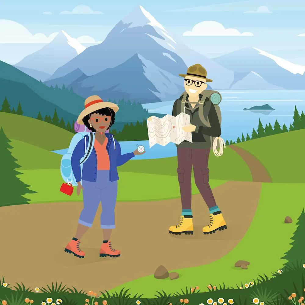 Two people navigate using a map and compass while on a hike.