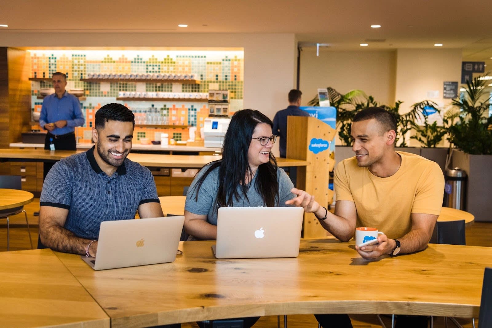 Three Salesforce employees working together