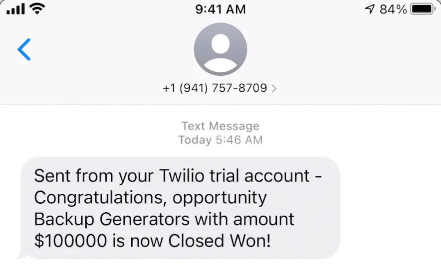 Mobile phone showing text message from Twilio.