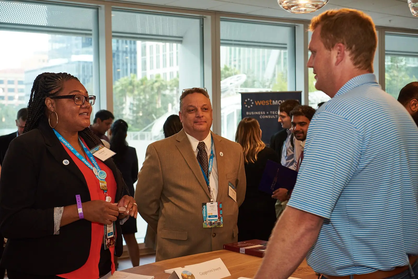 Alt text: Three people meeting at a Trailhead Military recruitment event.