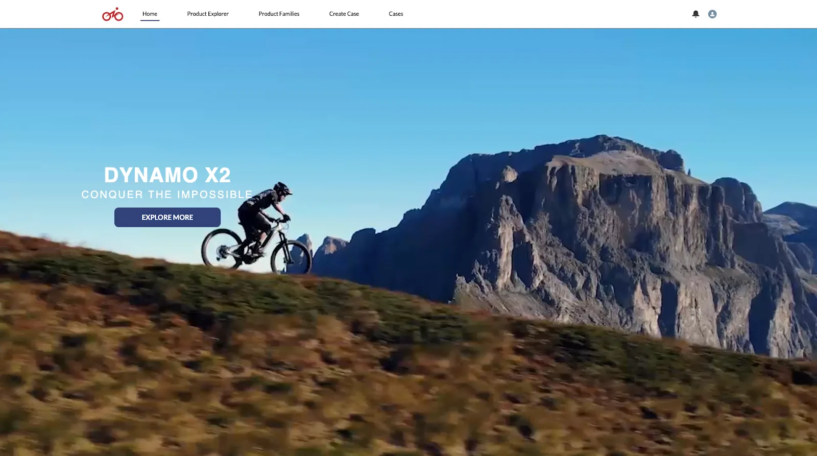 E-Bikes Community home page showing a man riding a bike through the mountainside. There’s an Explore More call-to-action button under the brand tagline.