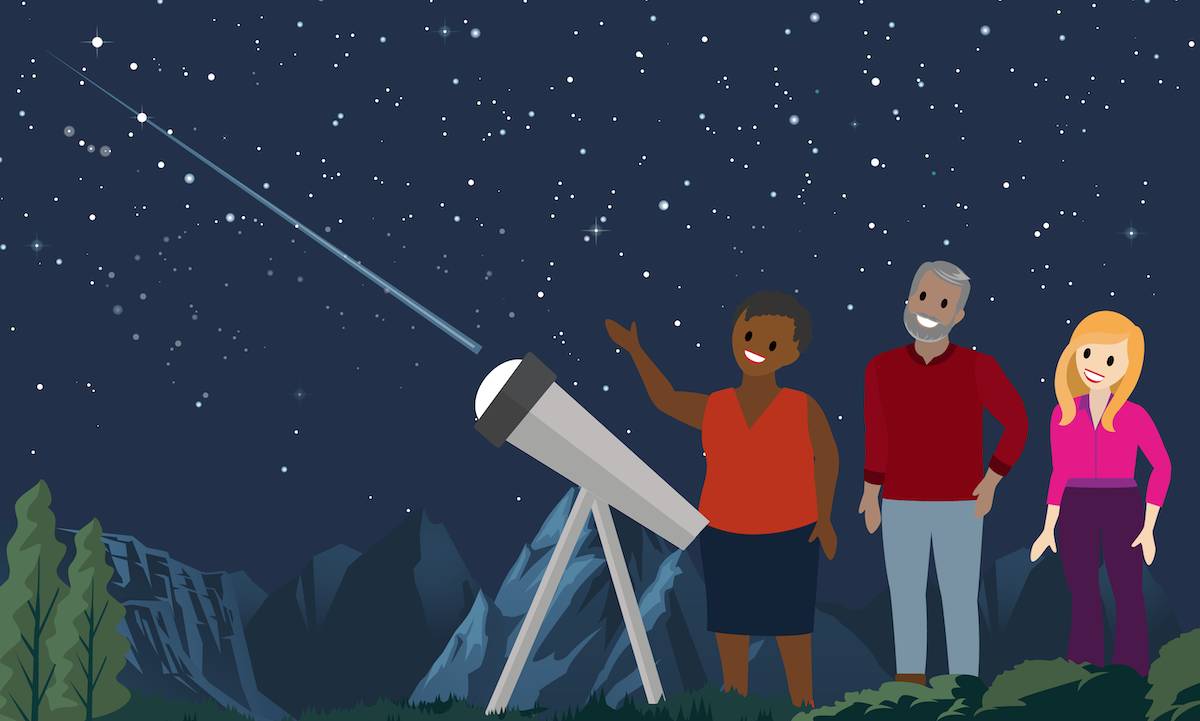 Against a backdrop of mountains, three smiling people gather around a telescope and share a vision of the night sky