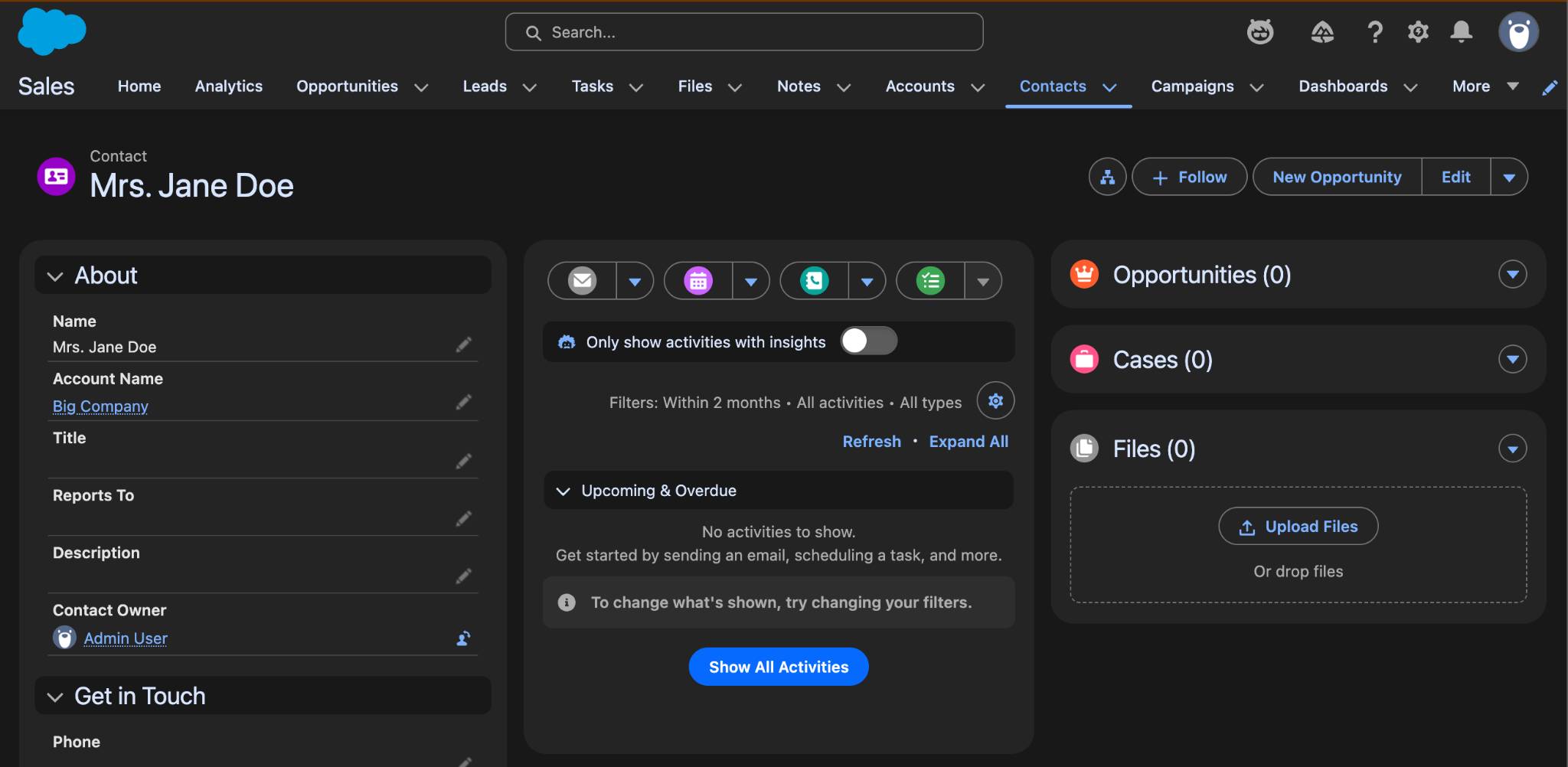 An example Salesforce org Contact page in Salesforce Cosmos theme dark mode, with a black background, white text, and bright-colored Salesforce Lightning Design System 2 buttons.
