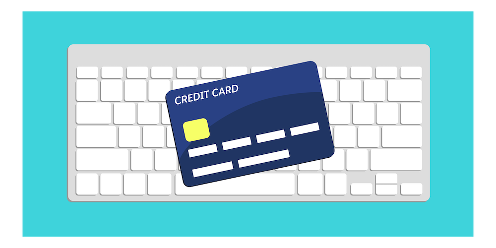 A credit card on top of a keyboard