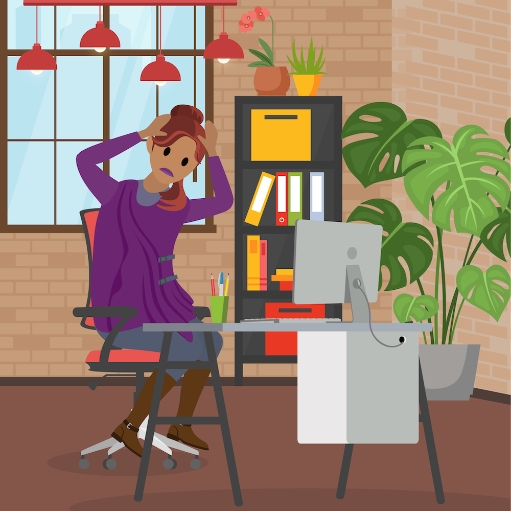Picture of a frustrated user at her computer desk.
